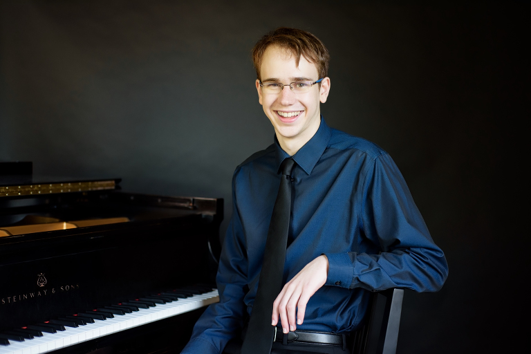 Portrait of Gregory, Class of 2018 Jazz Pianist at the piano | Wohler & Co.