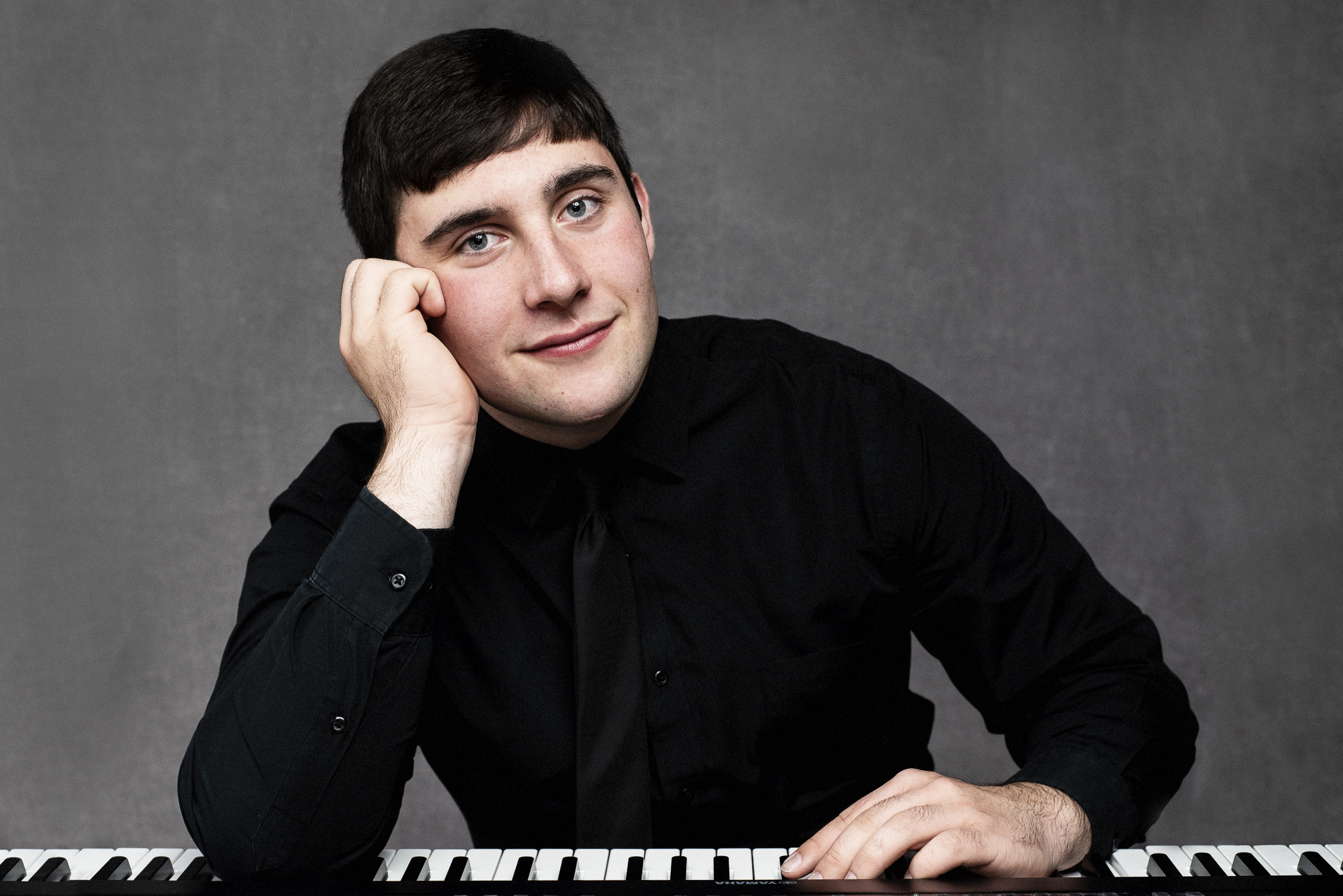 Portrait of Colby Ellis at a keyboard | Why Music