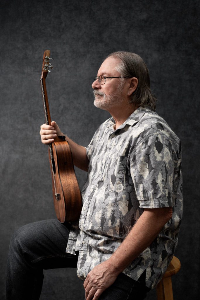 Jim and one of his many Ukulele