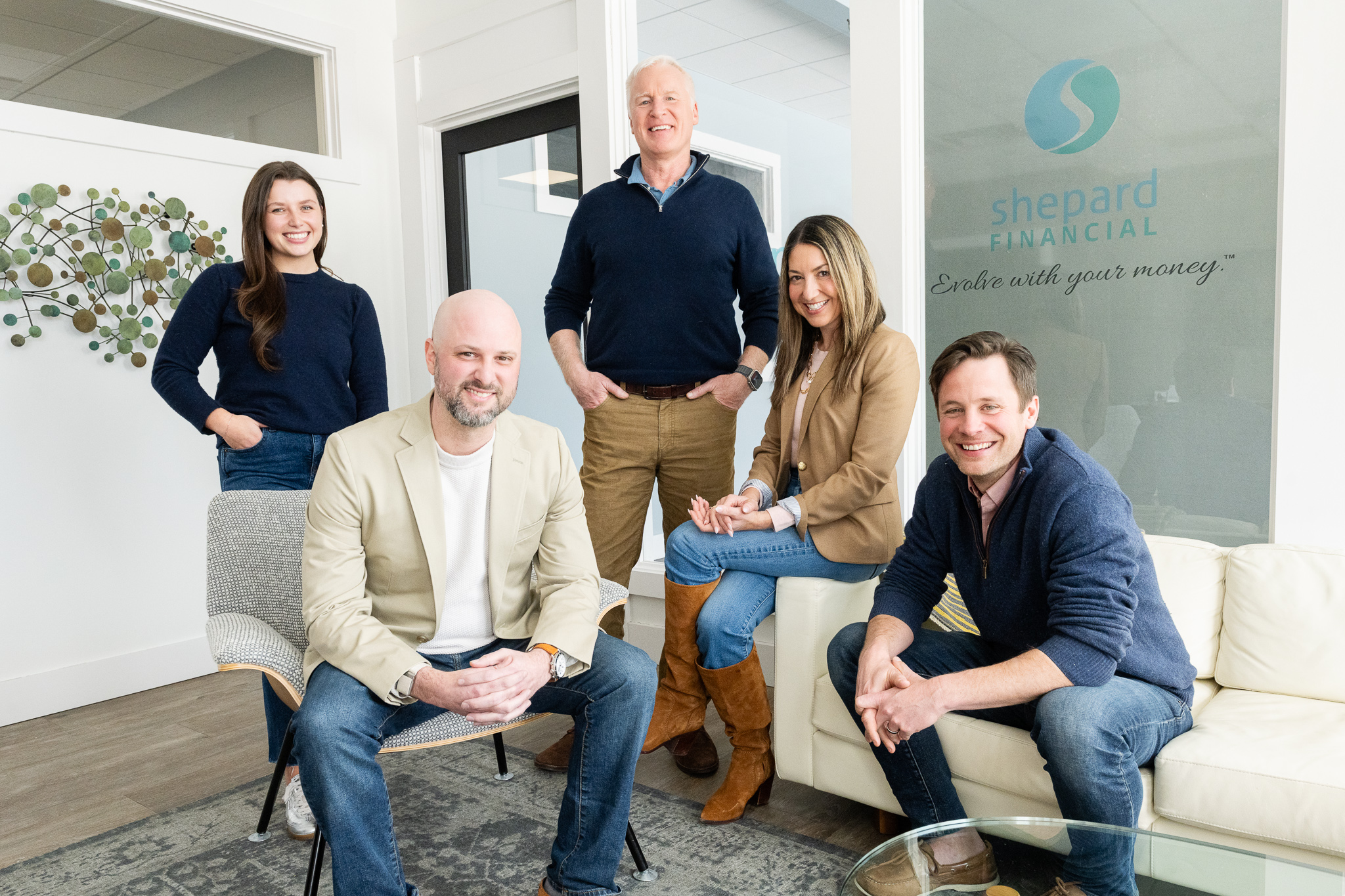 The shepard Financial team photographed together in the lobby of their Yarmouth, Maine office by Wohler and Co.