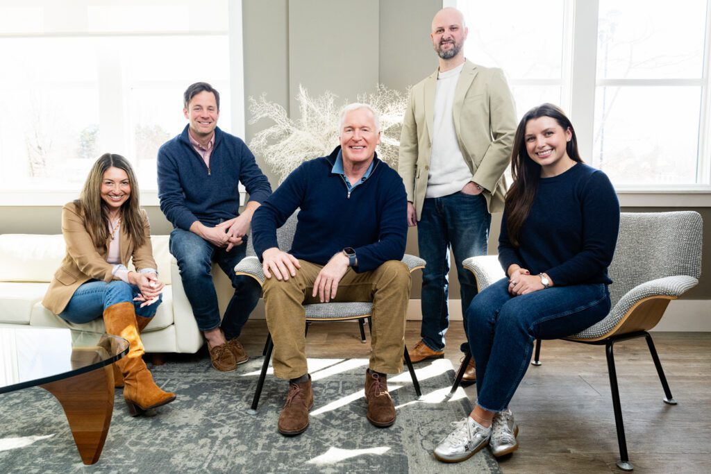 The shepard Financial team photographed together in the lobby of their Yarmouth, Maine office by Wohler and Co.